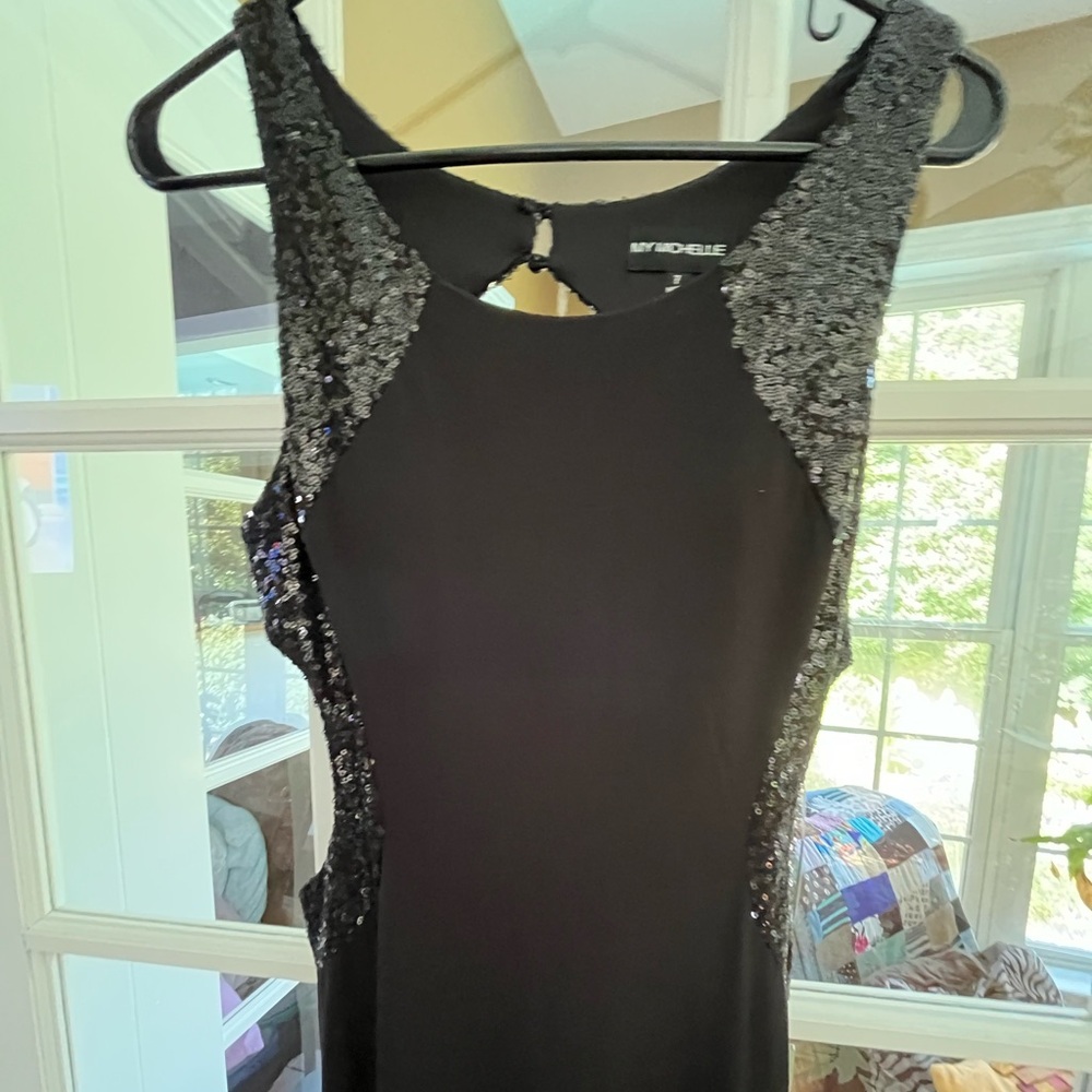Beautiful black maxi formal dress. Size 7 brand new. My Michelle